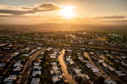 The sun rising over a beautiful residential community where everyone is a member of the HOA.