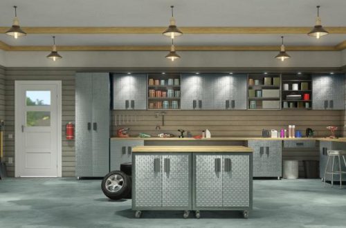 A modern, functional garage layout with a workbench as an island and shelving on the walls. There are six pendant lights.